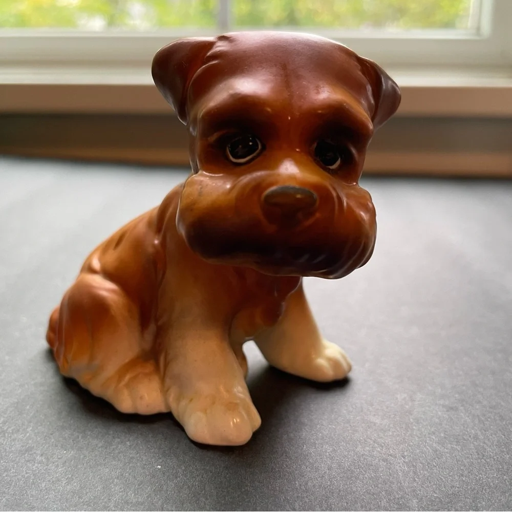 Vintage grumpy anthropomorphic brown dog figurine.